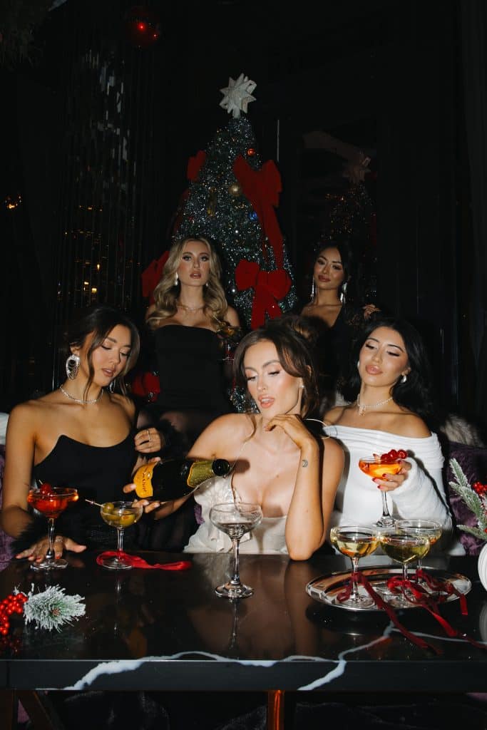 Guests celebrating with premium cocktails during an upscale holiday party at SideBar San Diego.