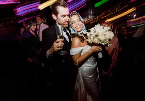 Wedding party sharing a celebratory toast during their Side Bar night out